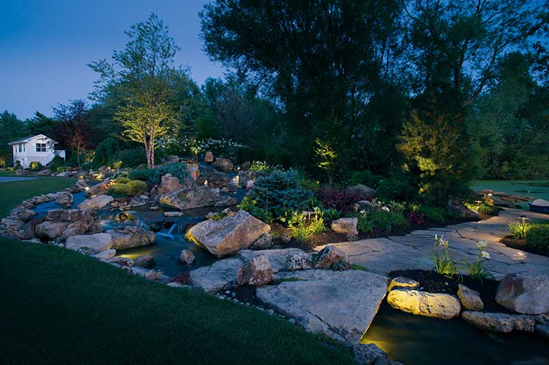 Affordable Irrigation lights throughout newly landscape stone garden Photo 9